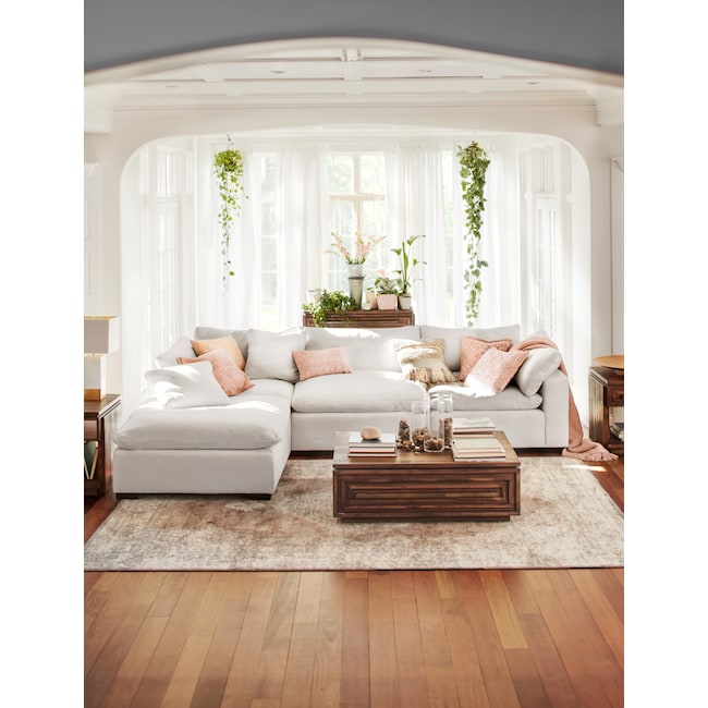 Plush 4Piece Sectional and Ottoman Anders Ivory American Signature