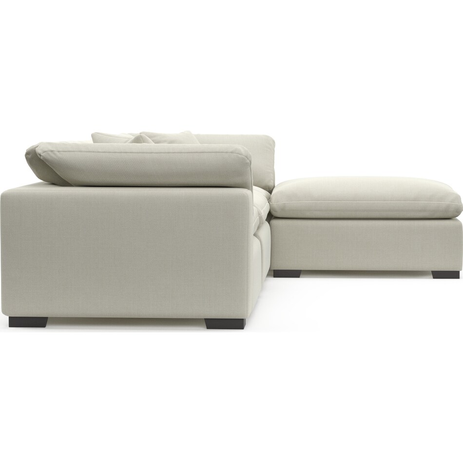 plush white  pc sectional and ottoman   