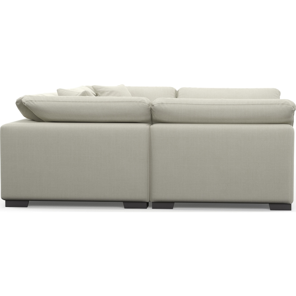 plush white  pc sectional and ottoman   