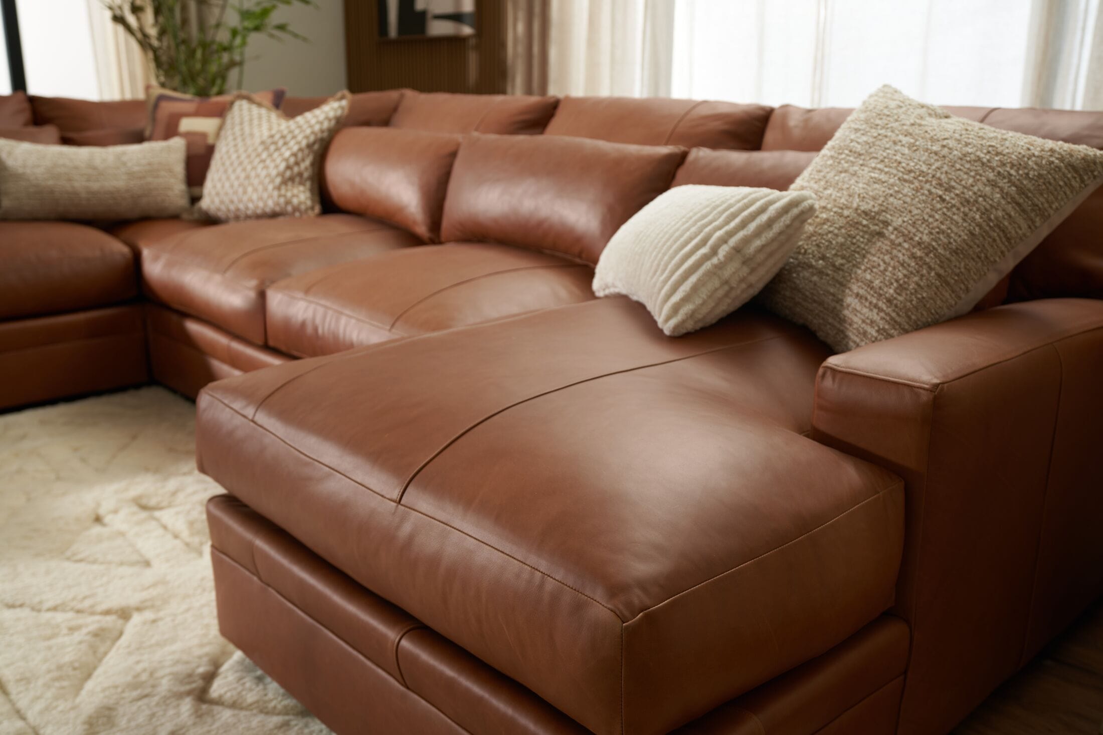 Brown leather sectional with outlet chaise